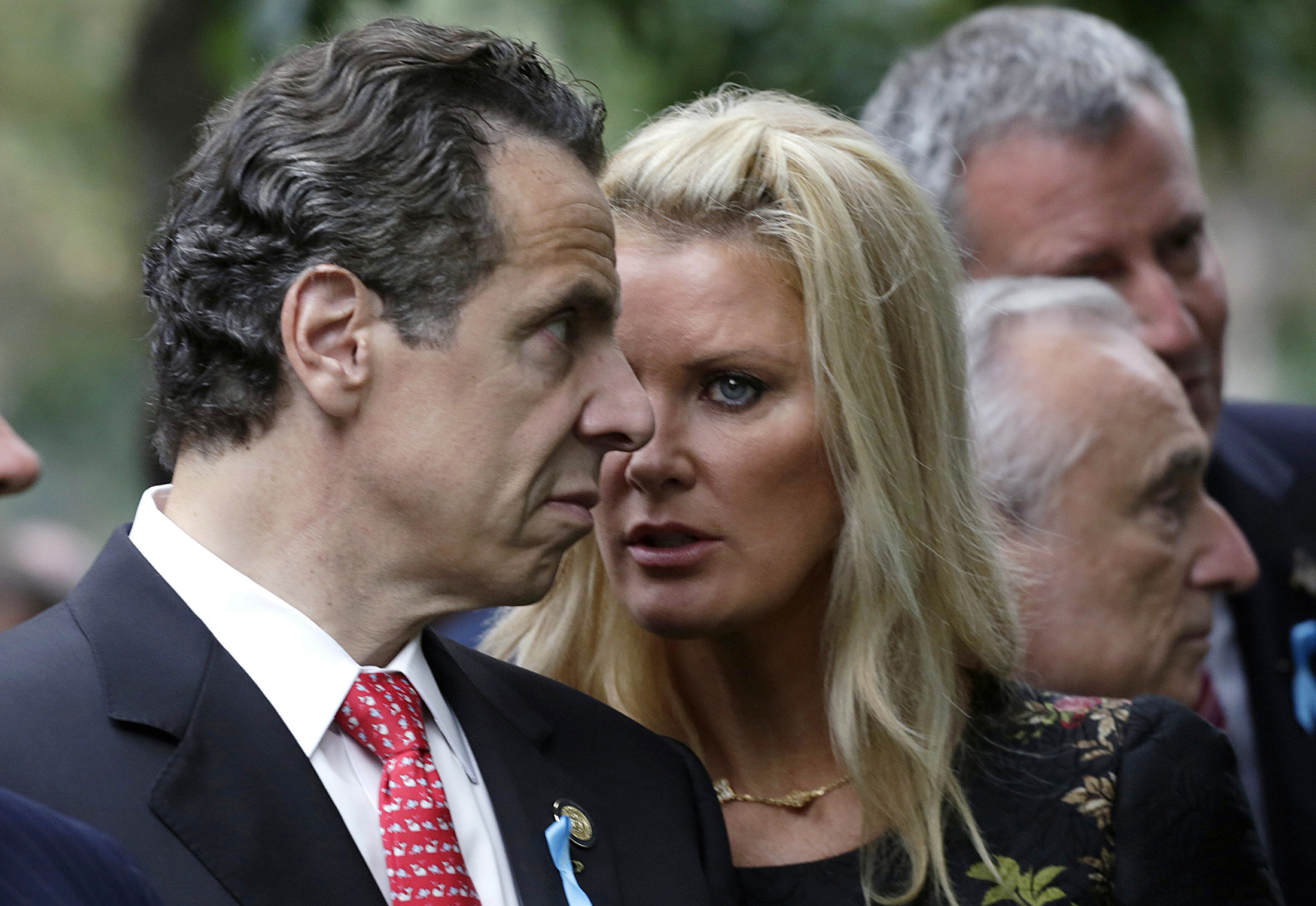 New York Governor Andrew Cuomo and his partner Sandra Lee talk during memorial observances held at the site of the World Trade Center in New York
